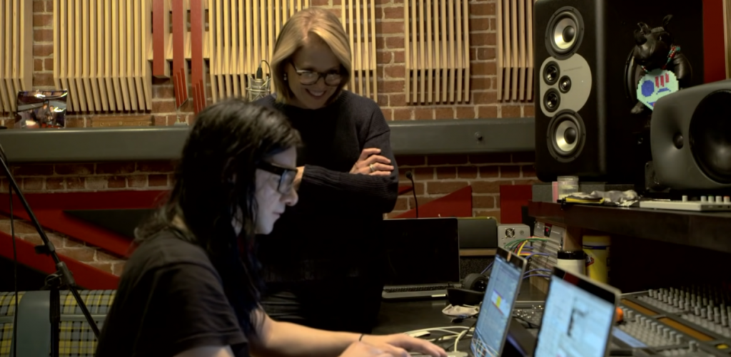 skrillex uses laptop and equipment in the studio for an interview with Yahoo! News
